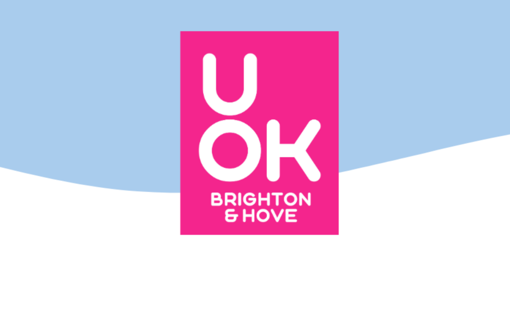 UOK Brighton and Hove logo in a white font